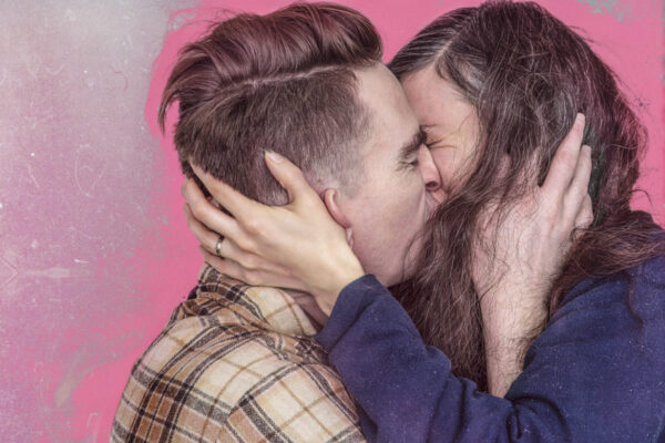 A couple consensually making out together