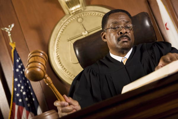 A judge holds his gavel, during the trial phase of the DUI process