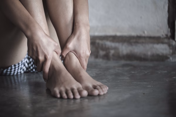 Statutory Rape 1 A young girl grabs her ankles, perhaps because she is an alleged victim of statutory rape